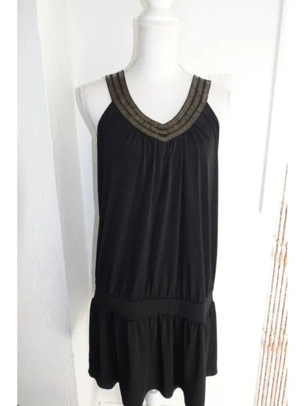 Black Sleeveless Drop-Waist Mini Dress with Embellished Neckline
